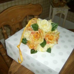 Decorative ball with silk flowers.