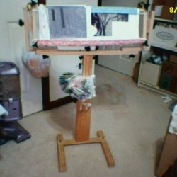 Cross stitch project in floor frame.