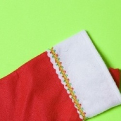 A classic red felt Christmas stocking, ready to be filled.