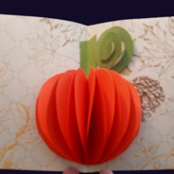 A popout orange pumpkin card