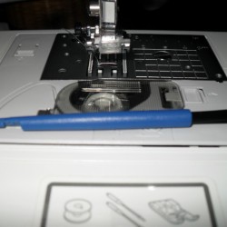 Sewing machine needle tool.