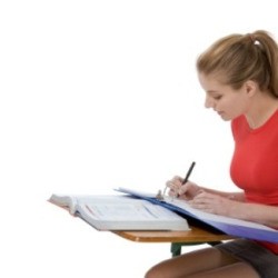 A young college student doing homework.