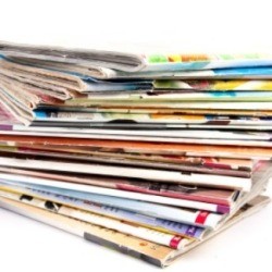 A large stack of food magazines.