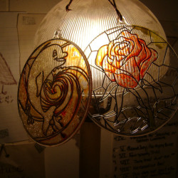Displaying Children's Plastic Stained Glass Crafts - two plastic stained glass circles on lamp shade