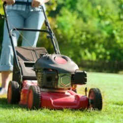 A person mowing the lawn