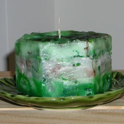 A speckled homemade candle made from crayons.