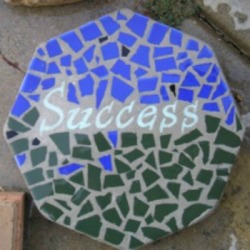 Mosaic Stepping Stone - using blue and green pieces and the word 