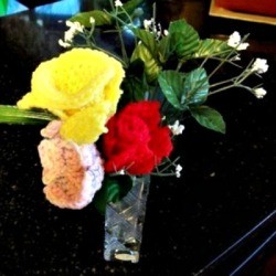 red, yellow, and pink crochet flowers