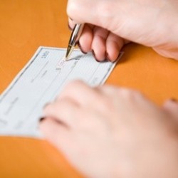 Woman writing a check.