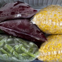 Frozen vegetables in freezer safe bags.