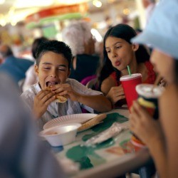 Family eating food while on vacation.