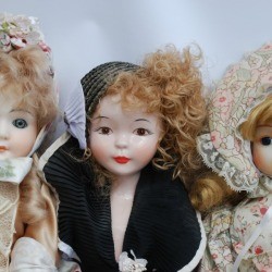 Photo of 3 vintage porcelain dolls.
