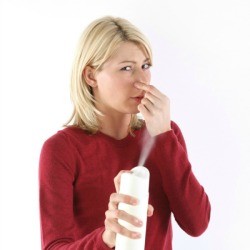 Woman Deodorizing in Her Home