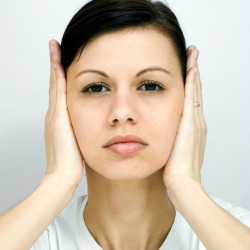 A woman with itchy ears.
