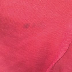 Peach shirt with stains.