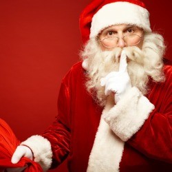 Santa and his bag whispering hush. 