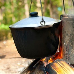 A pot cooking over a fire.