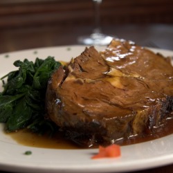 Prime rib with spinach.