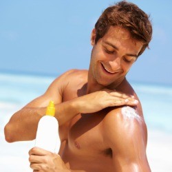 Man Applying Sunscreen to Himself