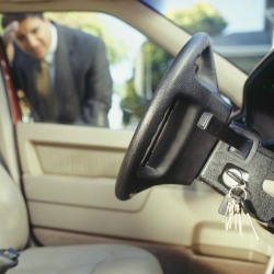 Man Looking Keys Locked in Car