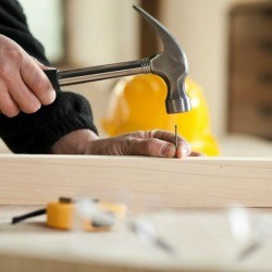 Man Hammering Nails