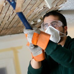 Man Remodeling a Basement