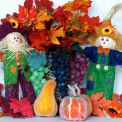 smiling scarecrow and leaves decoration