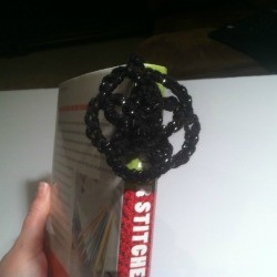 A crocheted medallion bookmark.