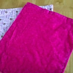 A completed set of flannel baby burp cloths