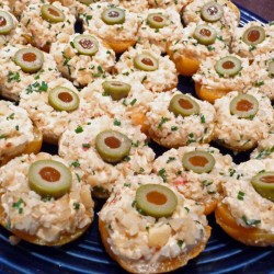 A plate of chicken gorgonzola stuffed apricot cups