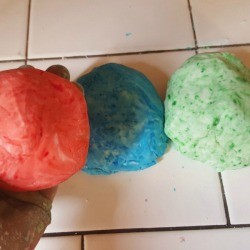 three balls of colored dough