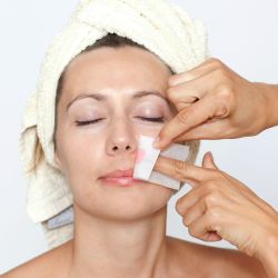 woman having facial hair removed