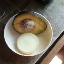avocado half with onion slice