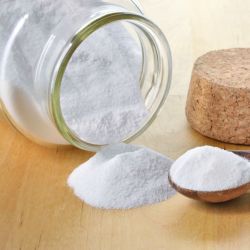 glass jar with baking soda and spoon