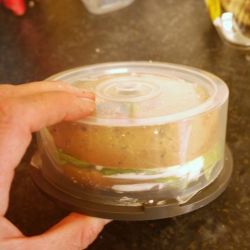 Bagel sandwich has been placed in the case.