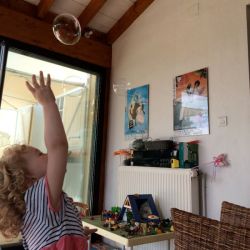 child chasing a bubble