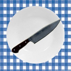A Corelle plate used as a cutting board