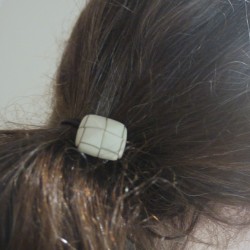 button hair tie in hair