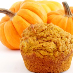 Pumpkin Spice Cupcake in front of several small pumpkins