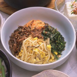 Korean food spread centered on meal in a bowl