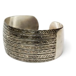 Silver bangle bracelet against white background