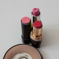 Three old used tubes of lipstick