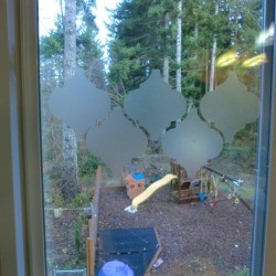 contact paper shapes being applied to small window