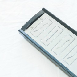 Adjustable bed control remote against white background
