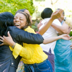 Women hugging outdoors