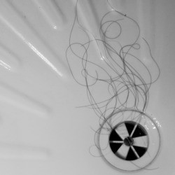 Long black hair near shower drain