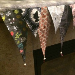 Halloween pennant decoration on fireplace mantel.