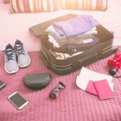 A well packed suitcase with travel basics.