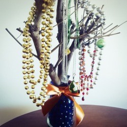 branch and jar jewelry tree with necklaces 