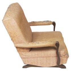 A chair with upholstery damage.